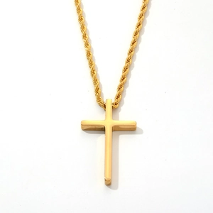 Minimalist gold stainless steel cross pendant necklace with polished finish on white background