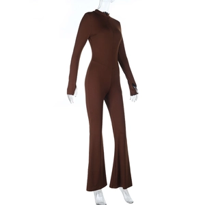 Detail of slim fit brown flare jumpsuit featuring thumb holes and zip-up collar design