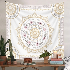 Detail of pink and gold mandala tapestry hanging on wall with bohemian style decor
