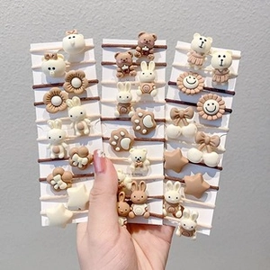 Detailed view of elastic hair bands with cute 3D cartoon bears, rabbits and flowers