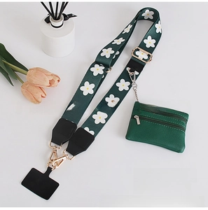 Detail of dark green floral wide shoulder strap with matching zipper coin pouch and gold hooks