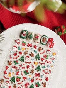 Close-up of 3D relief Christmas nail art stickers with Santa and reindeer designs