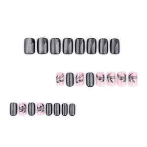 Set of 24 black cat eye and floral press-on nails in medium square shape on white background