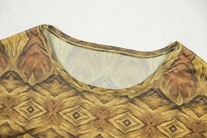 Close-up of the round neckline on a brown geometric print mesh fabric dress