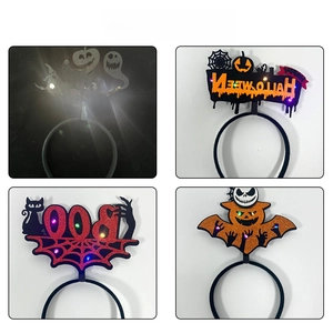 Close-up of four LED Halloween headbands featuring ghost, bat, and pumpkin designs