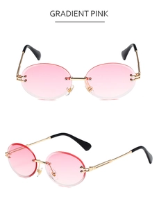 Detailed view of rimless oval sunglasses with gradient pink lenses and gold metal temples