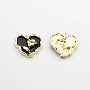 Detailed front and back views of heart charms with rose motif for DIY jewelry making