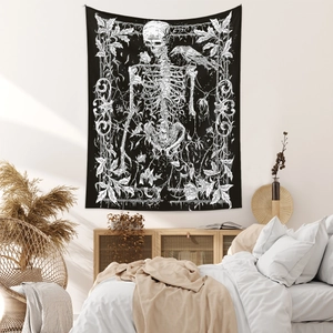 Detail of gothic tapestry featuring a detailed skull, raven and vintage floral patterns