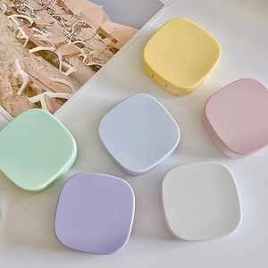 Portable candy colored square contact lens cases in various pastel matte finishes