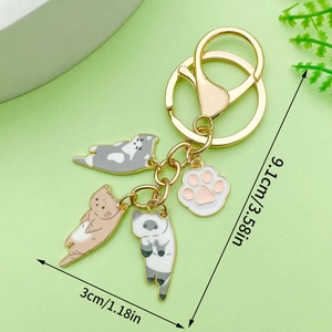 Leuke emaille katten sleutelhanger met drie kittens en een roze poot hanger