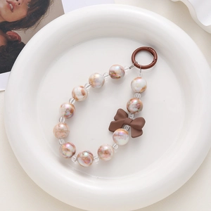 Iridescent beaded phone chain with a brown matte bow and a circular metal clasp