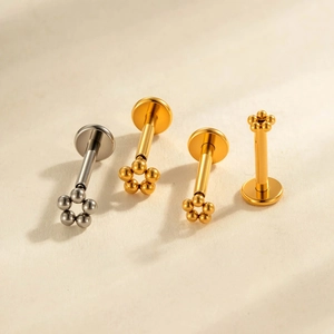 G23 titanium labret piercing stud featuring five-ball flower cluster in gold and silver