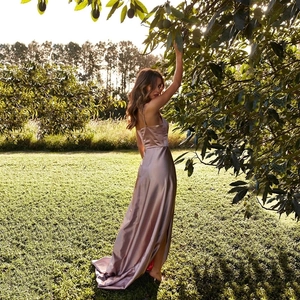 Elegant champagne satin evening gown with spaghetti straps and high side slit