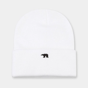 Detailed view of white knit beanie featuring black bear embroidery and ribbed texture
