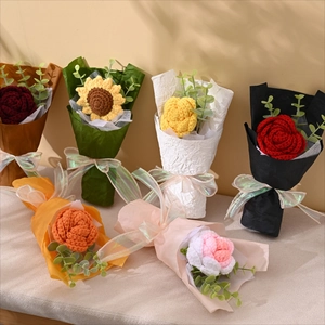 Hand-knitted sunflower and rose crochet bouquets with elegant paper wrapping and ribbons