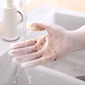 Durable white latex kitchen gloves for dishwashing and cleaning shown under running water