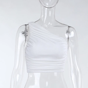 Detail view of a white one-shoulder pleated crop top, stylish and fitted silhouette.