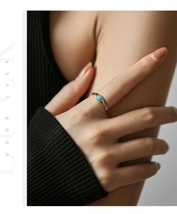 Close-up of a S925 sterling silver ring featuring a round turquoise opal stone inlay