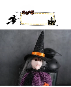 Close-up of Halloween witch hanging doll with purple hat and orange pumpkin detail