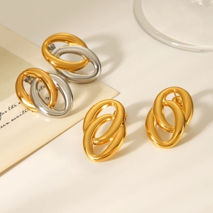 Detailed view of intertwined oval hoop earrings in gold and silver finish options