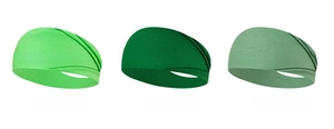 Detalle de cintas deportivas elásticas en tres tonos de verde con textura acanalada