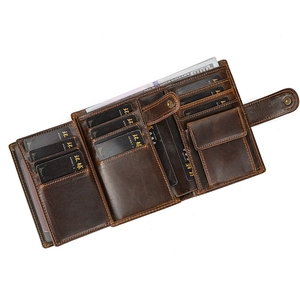Detail view of brown leather wallet interior with multiple card slots and snap coin pocket
