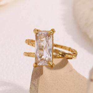 Detail of 18K gold-plated double-layer ring with rectangular zircon and hammered texture