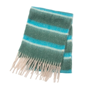 Detail of soft blue and green striped scarf featuring thick knit and beige tassels