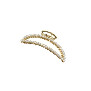 Elegant gold metal hair claw clip with white pearls in a crescent shape design