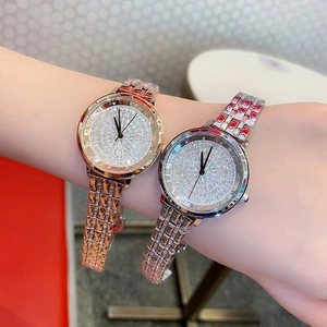 Luxe women's watch with diamond-encrusted dial and gold/silver metal chain straps