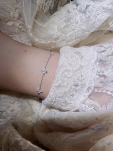 Macro shot of S925 sterling silver four-leaf clover bracelet with cubic zirconia