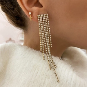Fashion S925 silver needle cross earrings with gold tassels and cubic zirconia on model