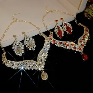 Elegant vintage jewelry set with teardrop crystals and sparkling stones in gold finish