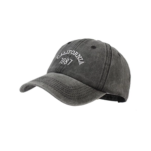 Vintage dark grey baseball cap with white CALIFORNIA 1987 embroidery on a white background