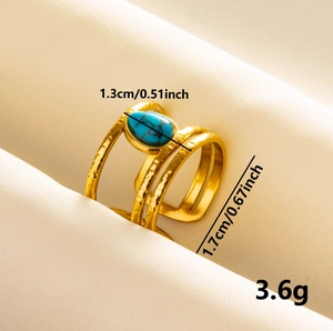 Gold plated wide hammered ring with oval turquoise stone and adjustable open band design
