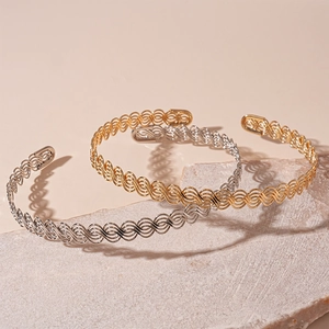 Chic woven metal open collar necklace in gold and silver with a layered hollow design