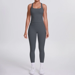 Detail of dark grey racerback sports top and high waisted yoga pants set with side pockets