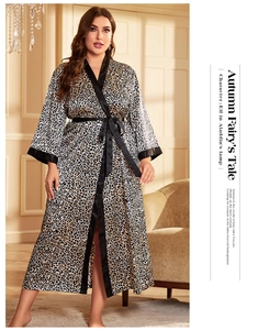 Detail of leopard print silk bathrobe with black satin trim and adjustable waist tie