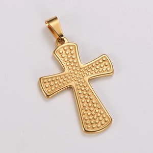 Detailed view of golden stainless steel cross pendant with embossed dot texture