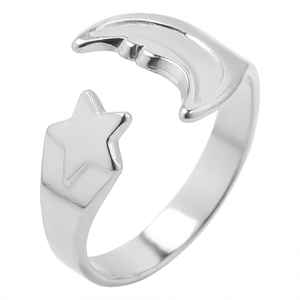 Detail of silver adjustable open ring featuring celestial star and crescent moon design