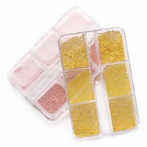 Mini metal nail art caviar beads in gold and rose gold colors within 6-compartment boxes
