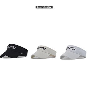 Detailed view of New York embroidered sun visors in black, beige, and white colors