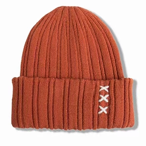 Thick knitted beanie with ear protection in deep orange featuring white cross embroidery