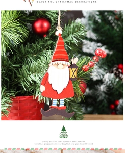 Detailed close-up of a wooden Santa gnome ornament hanging on a festive Christmas tree
