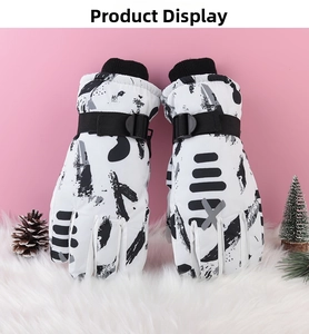 Close-up of waterproof winter ski gloves with floral pattern and adjustable wrist straps