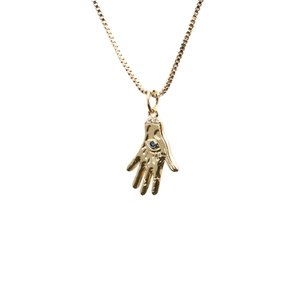 Gold Hamsa hand pendant necklace with blue eye stone and crystal accents on box chain