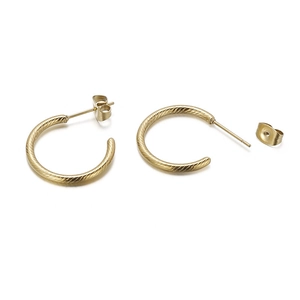 Minimalist golden stainless steel twisted hoop earrings on a clean white background