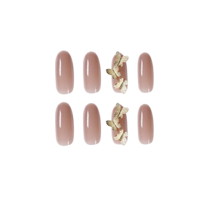Nude pink oval press-on nails set featuring delicate 3D golden butterfly embellishments