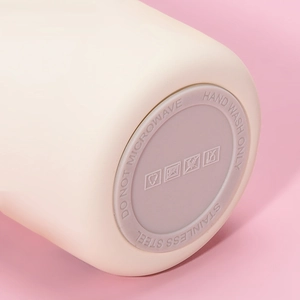 Detailed macro view of 316 stainless steel cup base with care icons and labels