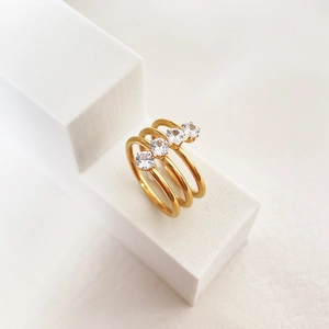 Sparkling stackable 18k gold plated titanium ring set with round cubic zirconia gems